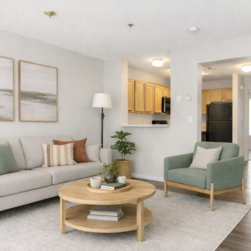 Staged living room with green accent chair