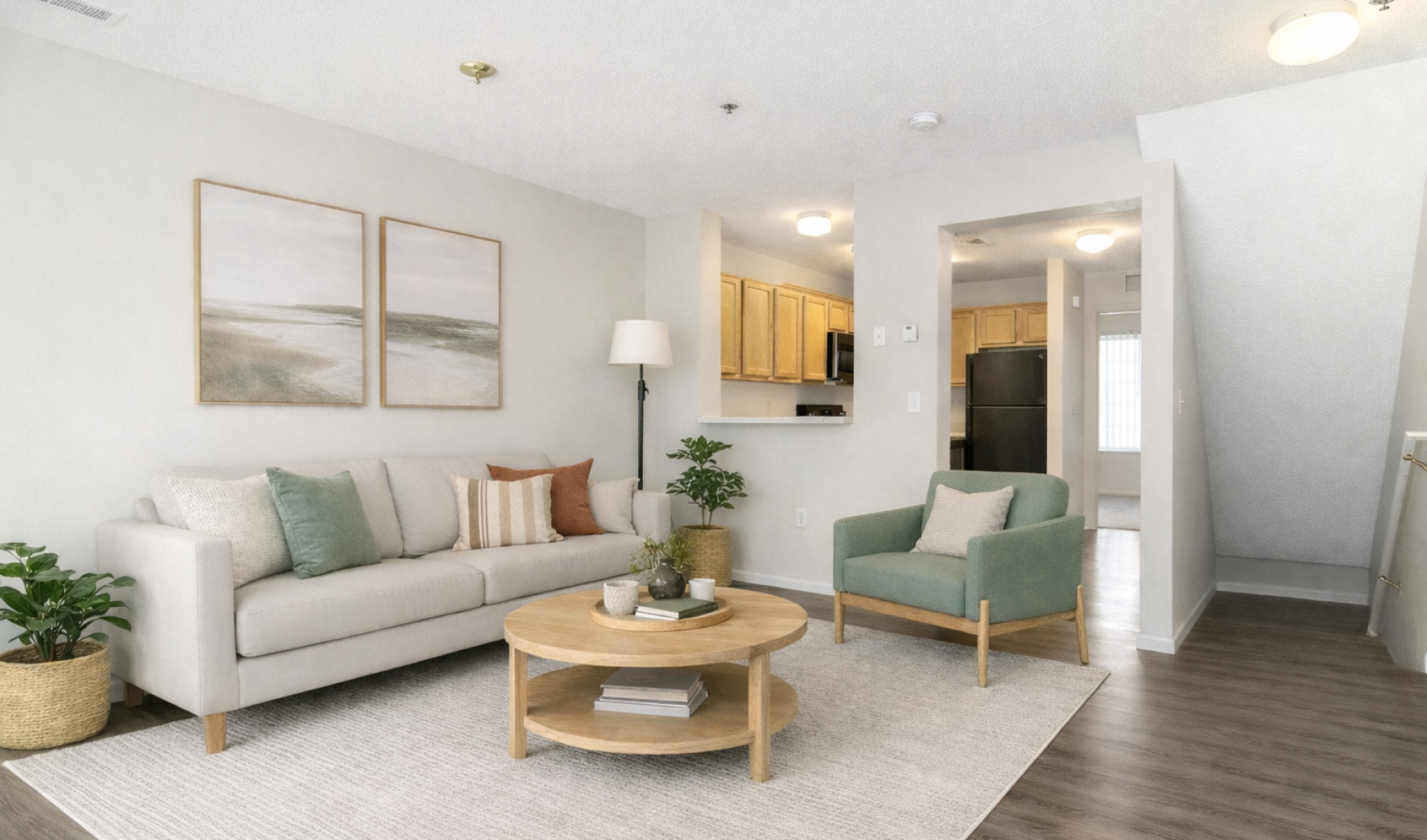 Staged living room with green accent chair