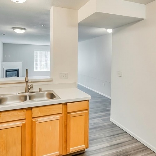 Settle into comfort at Wyngate Townhomes bright kitchen adjacent to living room