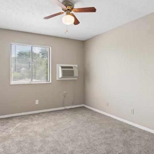 vacant bedroom with white walls