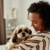 Girl holding a dog